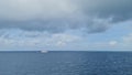 horizon of blue ocean and blue sky with white clouds. Boat on the horizon in the ocean. sea Ã¢â¬â¹Ã¢â¬â¹weather is calm.
